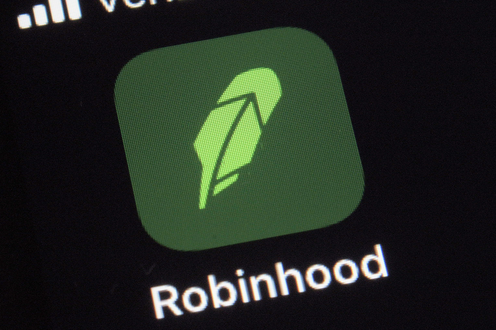 Den gröna ikonen för aktiehandelsappen Robinhood, på en smartphoneskärm. 