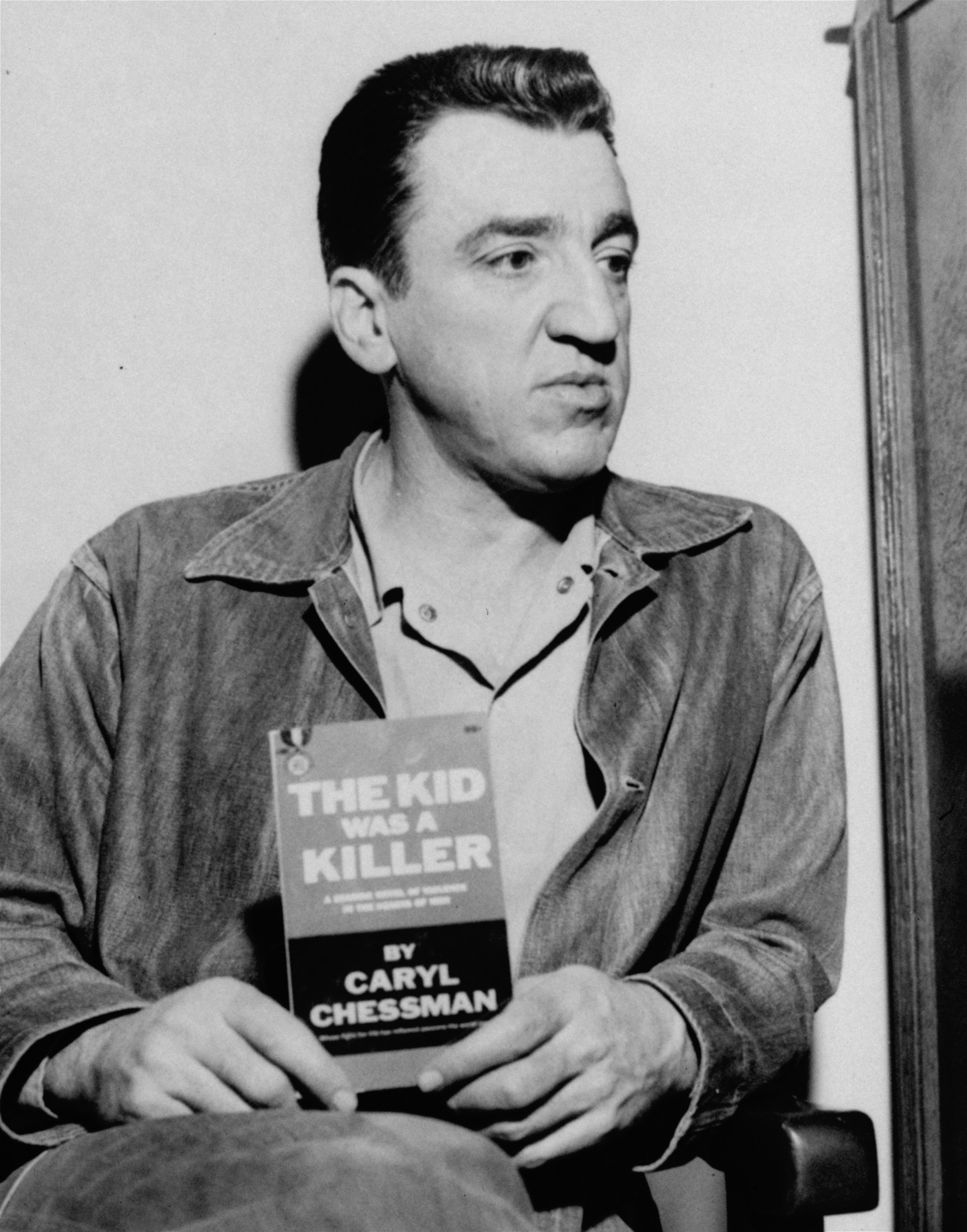 Convict and author Caryl Chessman, tells at what might be his final news conference at San Quentin Prison today, April 30, 1960, that he is prepared to prove his innocence of the crimes for which he is scheduled to be executed Monday morning.  The book the 38 year old Chessman holds,