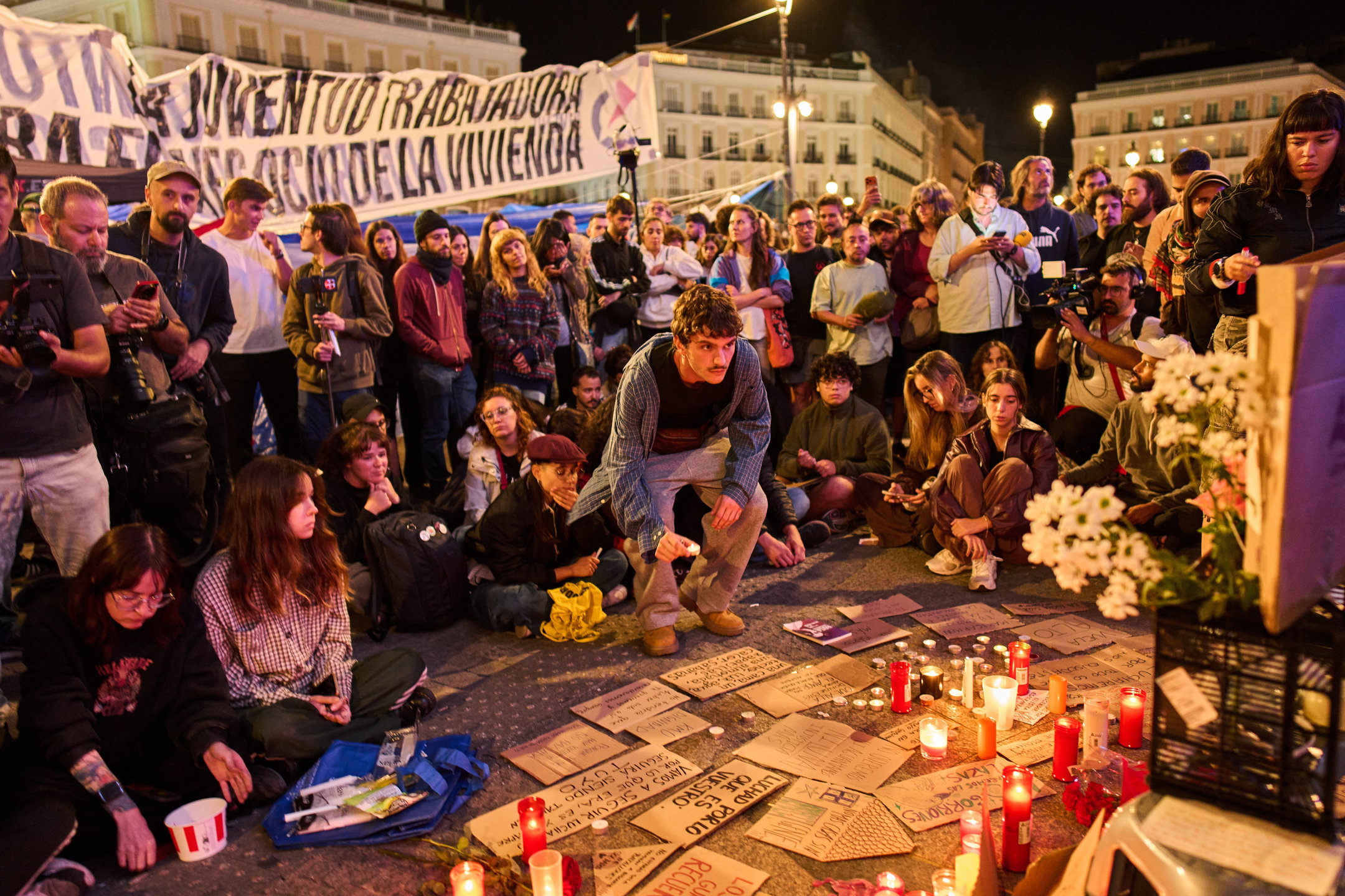 Protesters gather after the reported death of María del Carmen Abascal, the 87-year-old woman whose eviction sparked nationwide protests, in Puerta del Sol square in Madrid, early Thursday, Oct. 8, 2026.